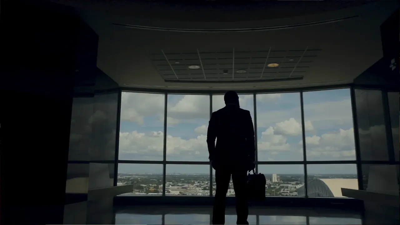 Attorney Quinton A. R. Brooker on a darkened set during the QB Law commercial shoot